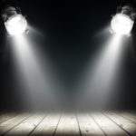 Dark background with spotlights