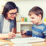 Teacher and Child at Kindergarten Classroom